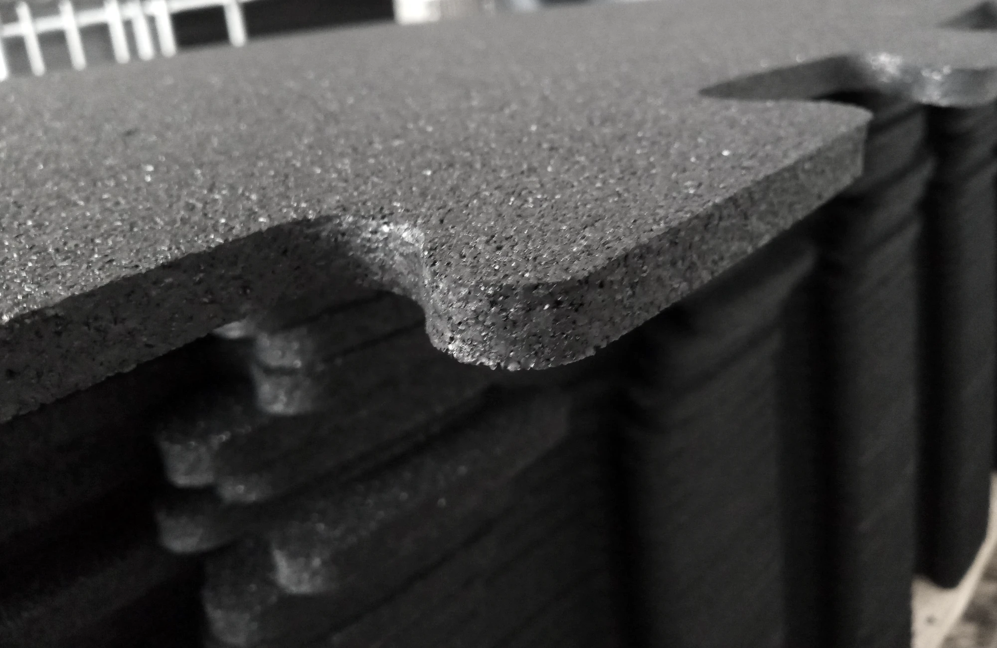 Close-up of the profile and edges of stacked RGR interlocking mats